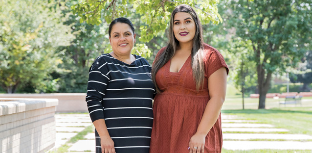 Noemi and Elizabeth Medina standing side-by-side on UNC's campus.