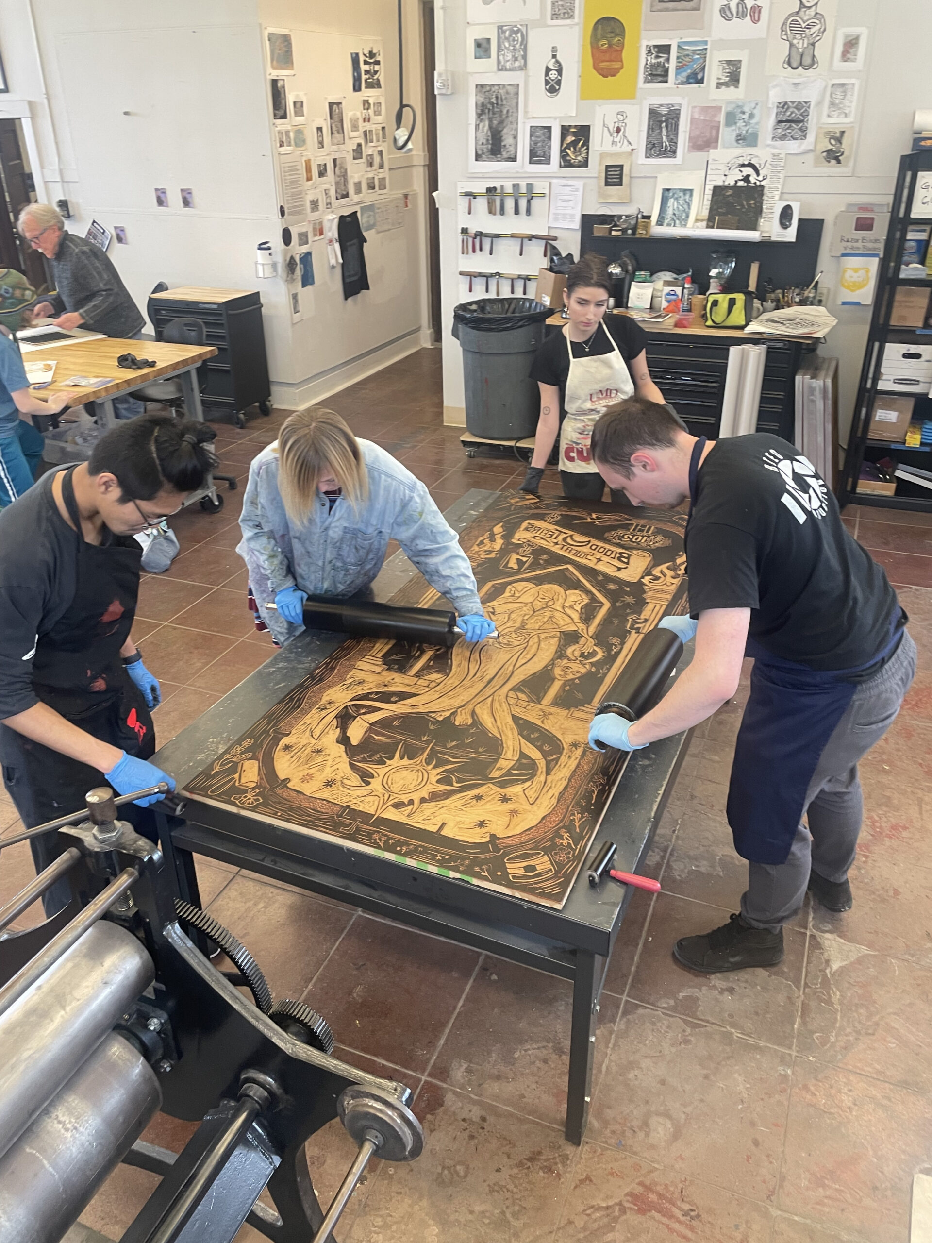 Students working together on a printmaking project.