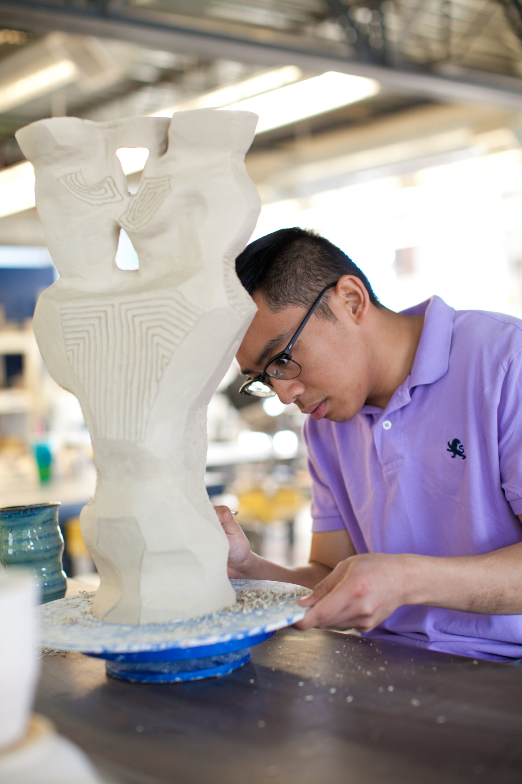 A student working on a sculpture.