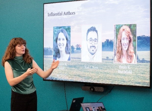 student presenting poster