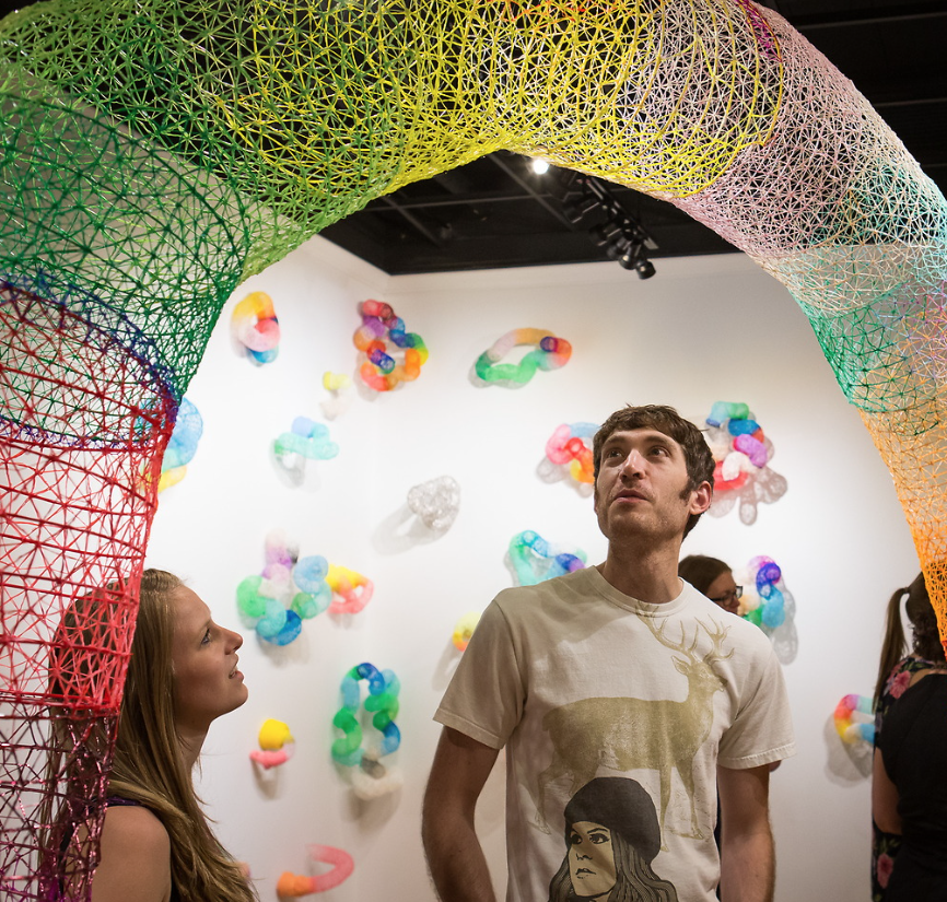 Guests observing an art installation at UNC’s Mariani Gallery.