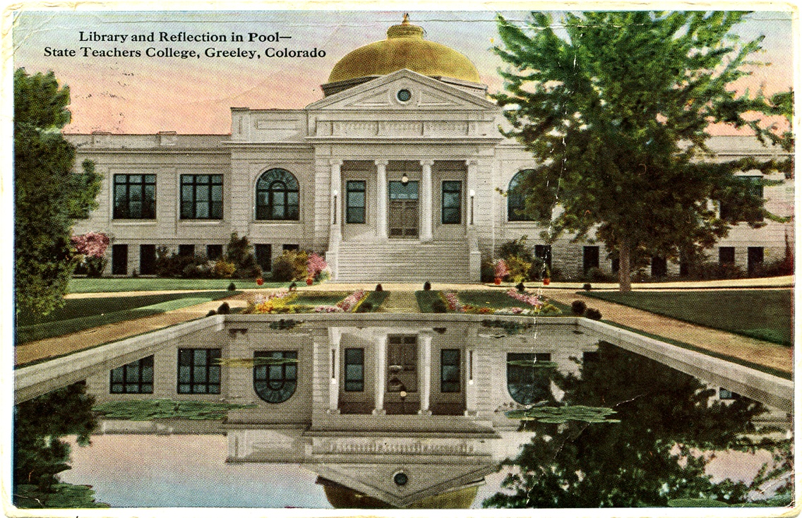 Exterior UNC library in the 1920s, a white building with a gold dome and a reflecting pool in front