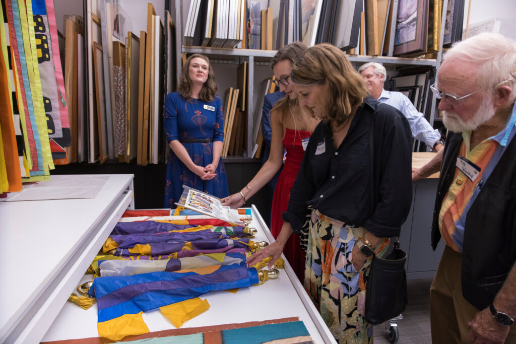 Guests viewing the Ruyle collection at the naming ceremony for the Lydia and Robert Ruyle Gallery.