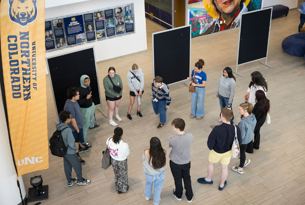 A group of students circled at the career readiness center's grand opening