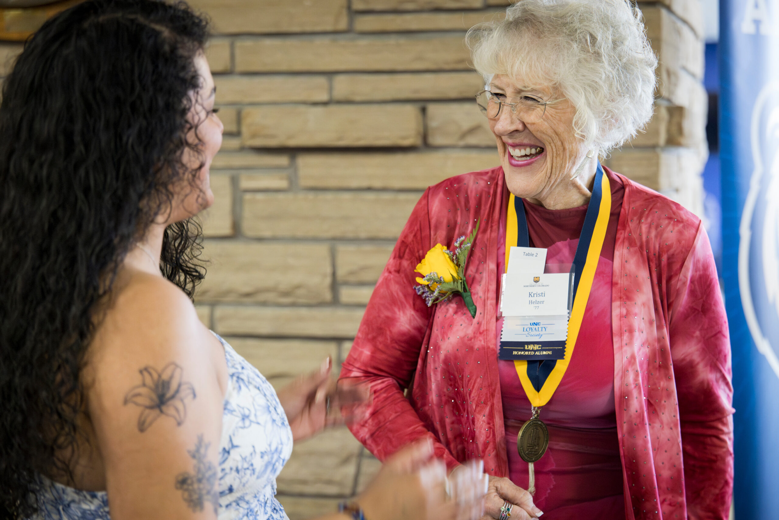 2026 Honored Alumni Kristi Helzer receiving her medal