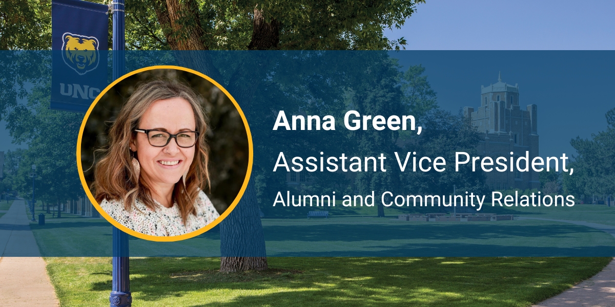 Anna Green, '01, facing forward and smiling on UNC-branded background
