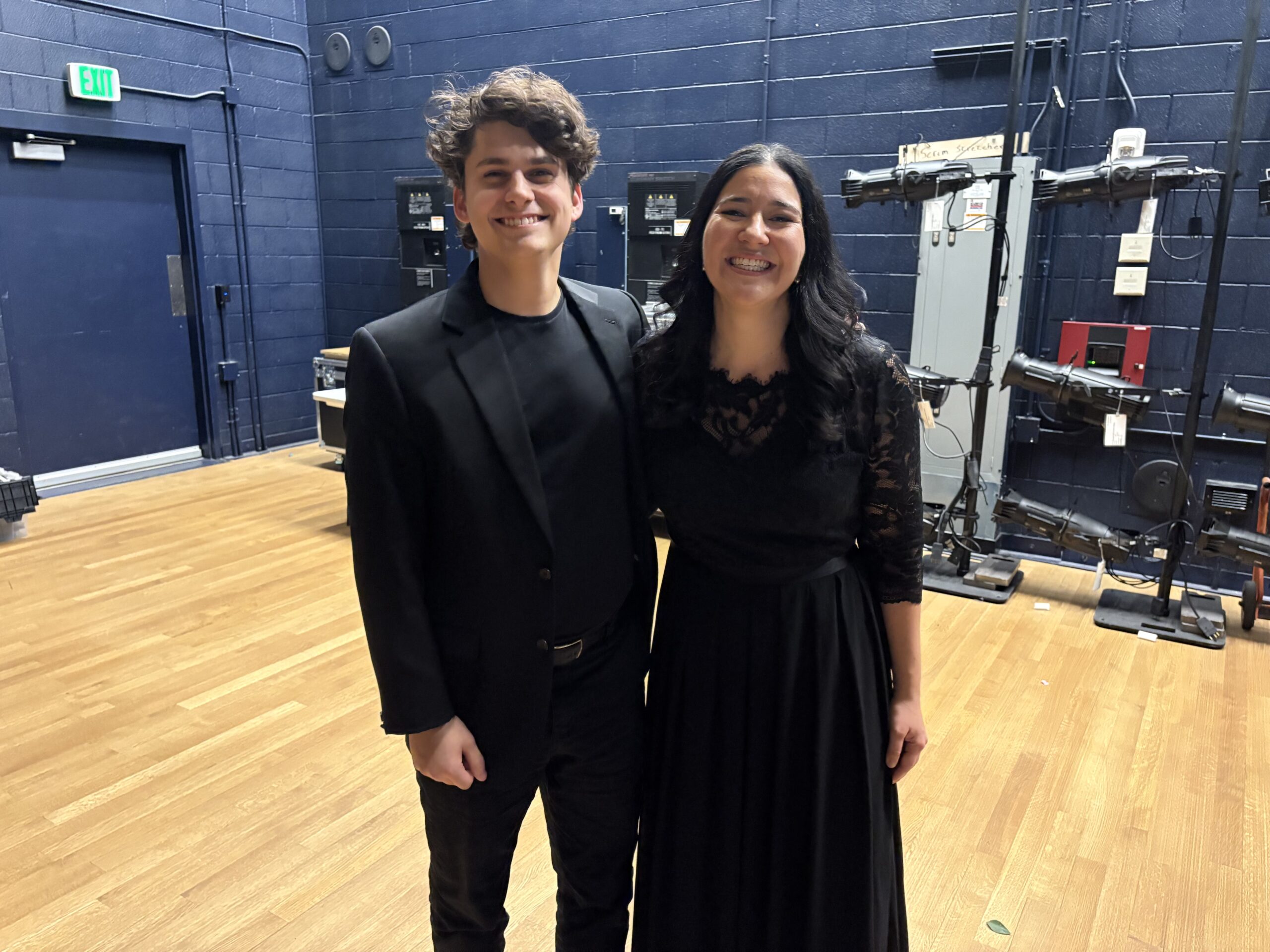 A photo of 9th Ave Voices directors backstage.
