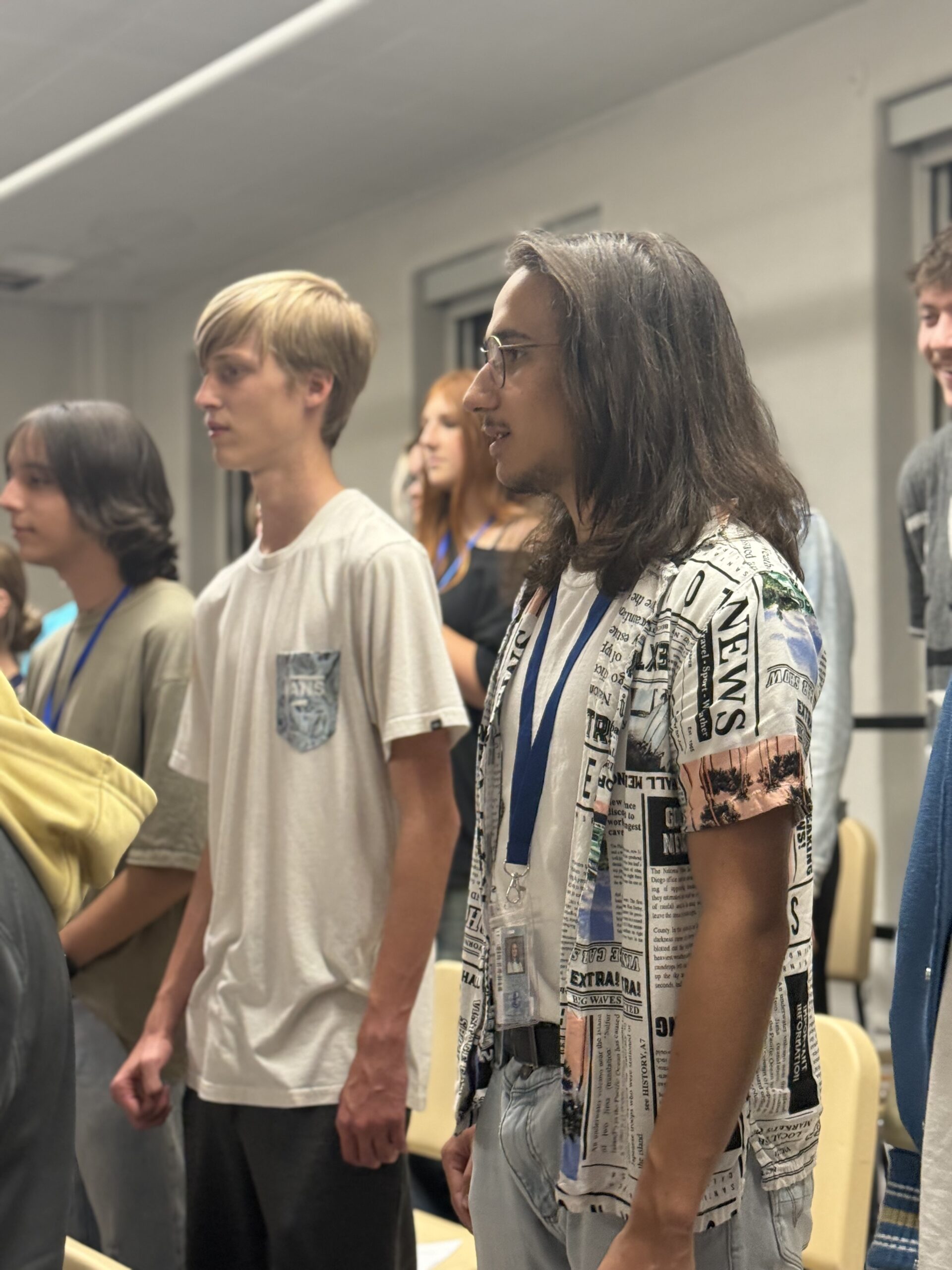 Three 9th Ave Voices singers during rehearsal.