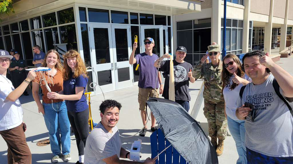 A group of UNC students outside launching a weather balloon