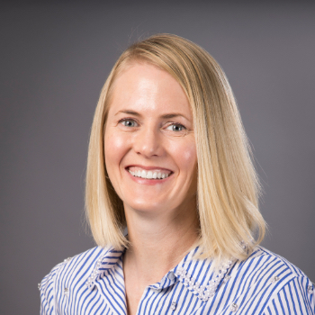 Headshot photo of Allison Devries in front of grey background.