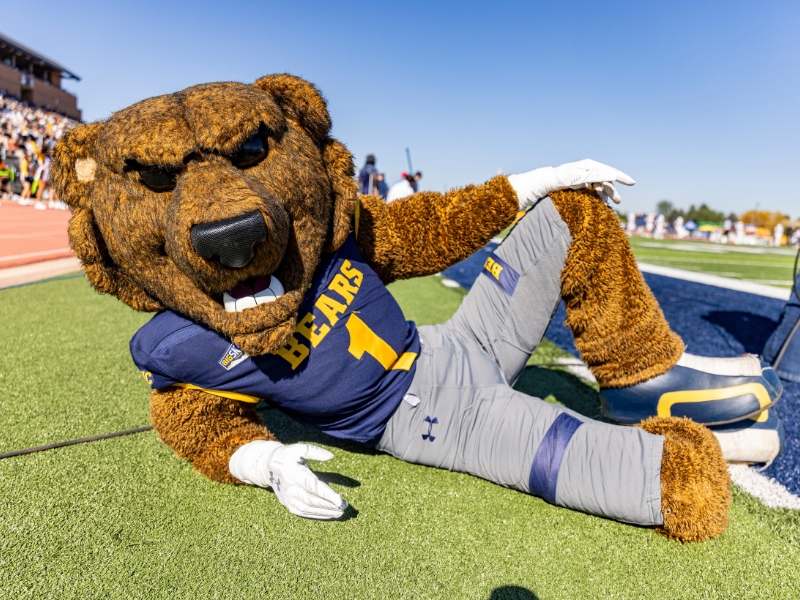 UNC Bear mascot Klawz poses on the football field