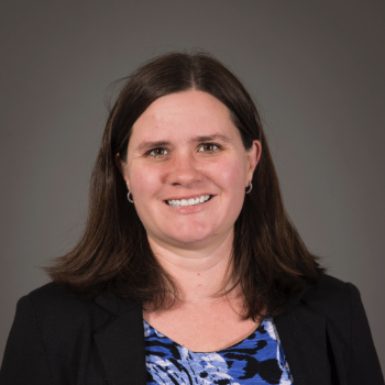 Headshot of Amy Bekins in front of a grey background