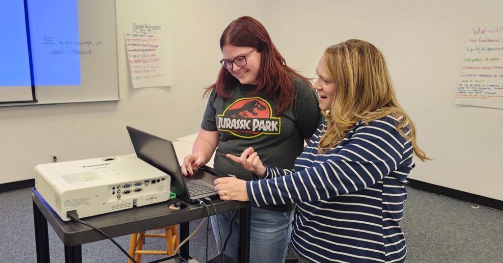 CUE Professor Courtney Goertz with a student