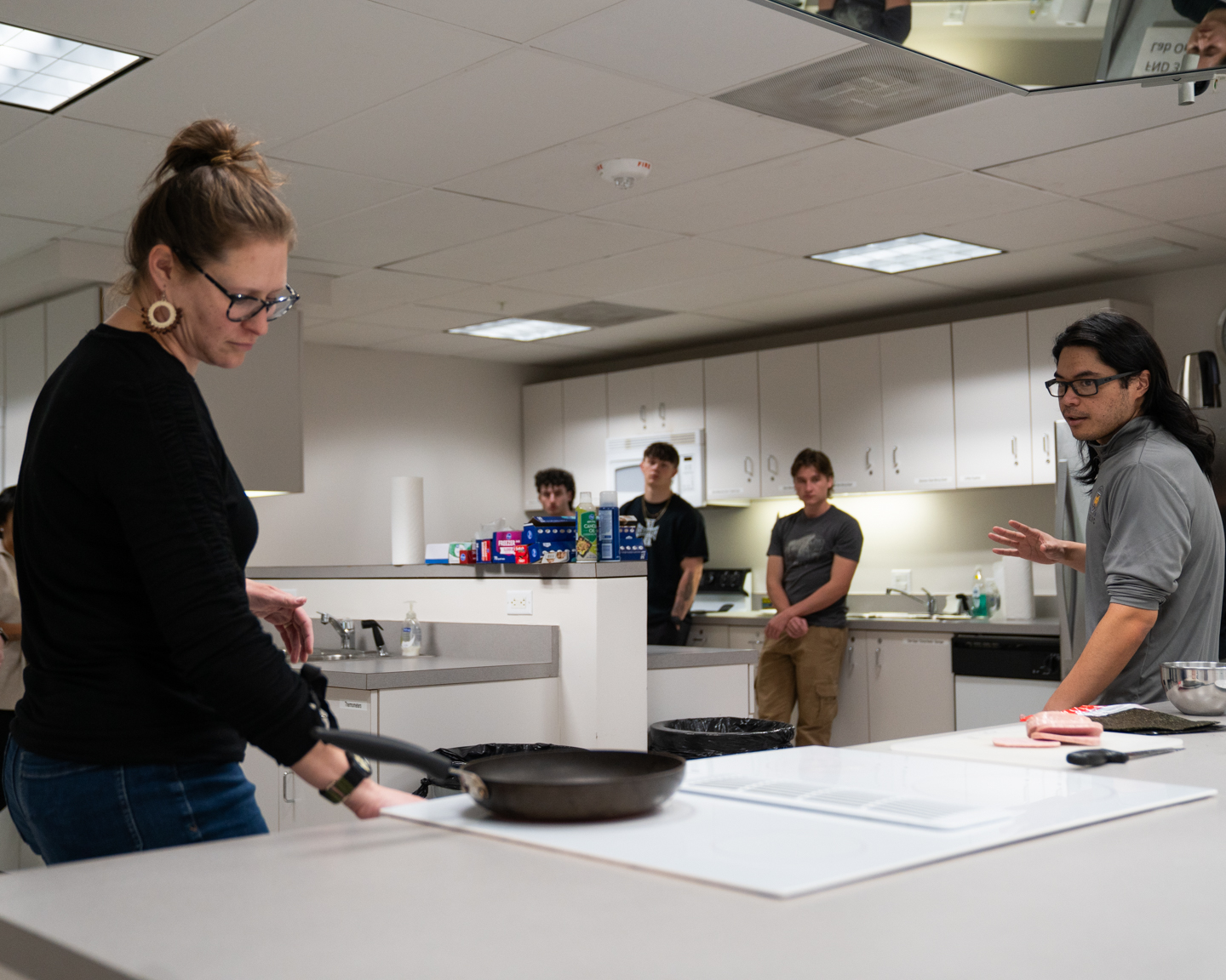 Professor Lisa Caldwell demonstrating food recipes in the Food Lab