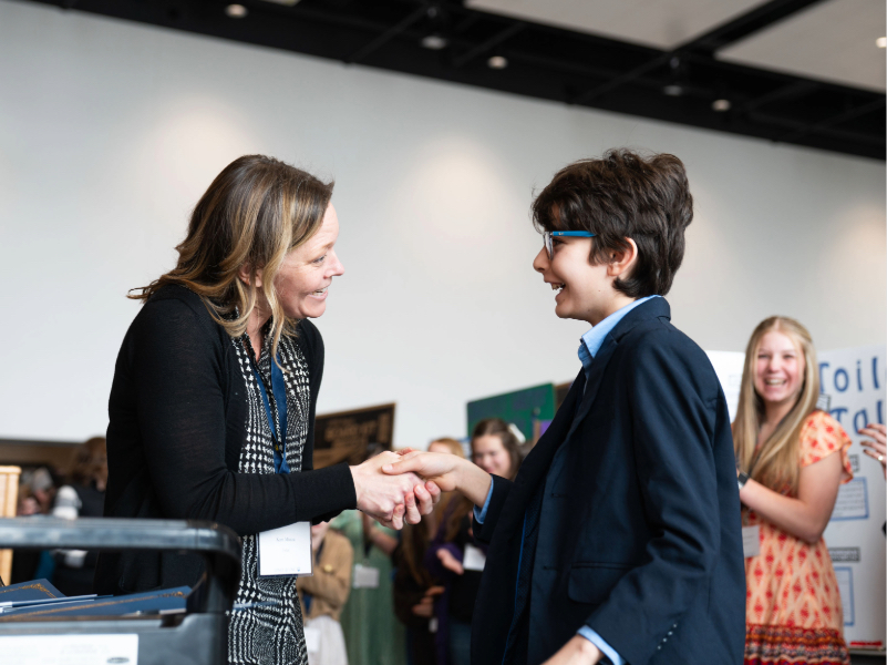 Photo of student being awarded at Longs Peak Science Fair