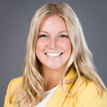 Headshot photo of Delaney Hull in front of gray background