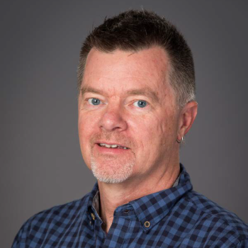 Headshot photo of Don Finan in front of a gray background
