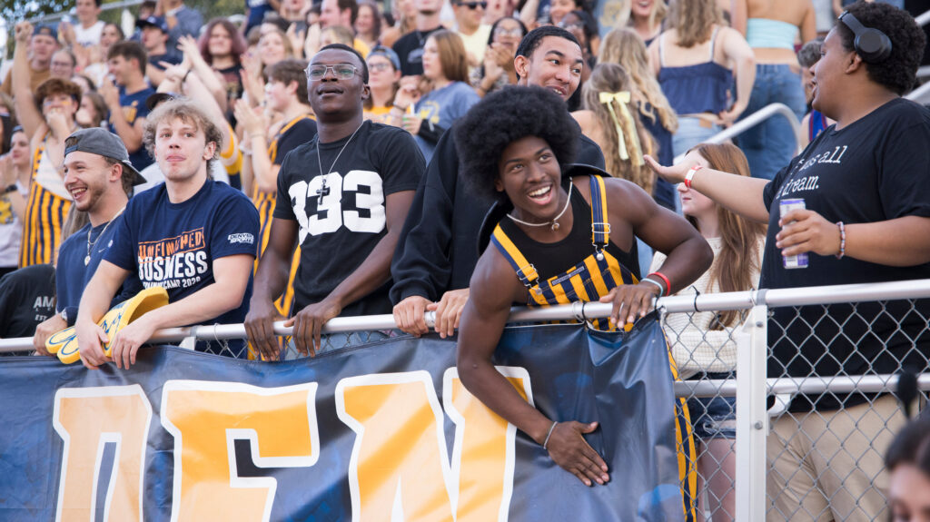 Fans in the stands at the Homecoming Football game
