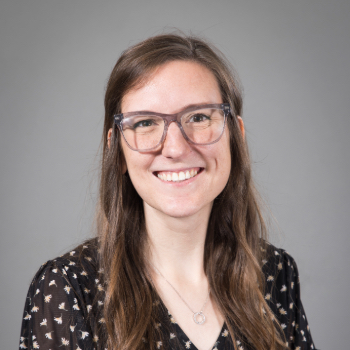 Headshot photo of Jennifer England in front of a gray background