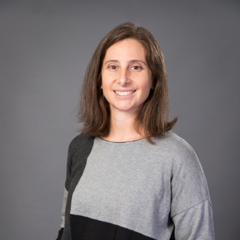 Headshot photo of Lauryn Benedict in front of a gray background