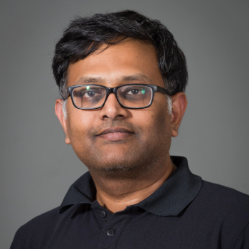 Headshot photo of Ramesh Muralimanohar in front of a gray background