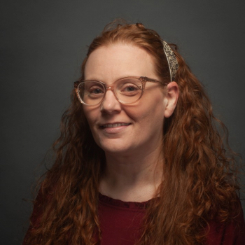 Headshot photo of Kelley Presley in front of gray background