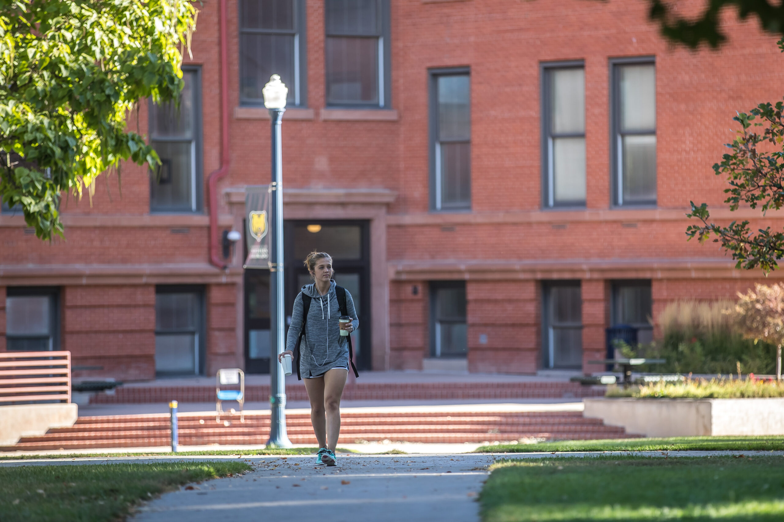 Student walking by Kepner Hall.