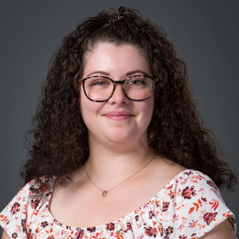 Headshot photo of Savana Estrada in front of gray background