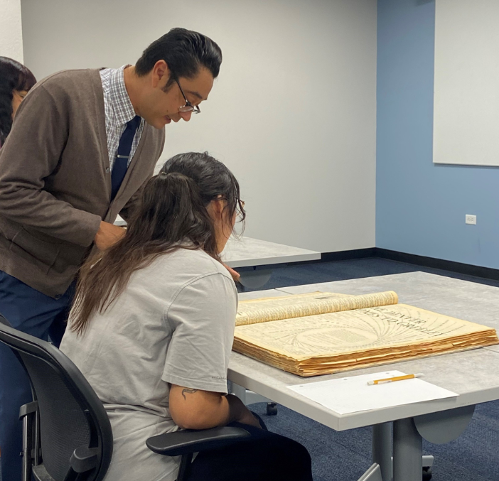 A Chicana/o and Latinx professor teaching their student