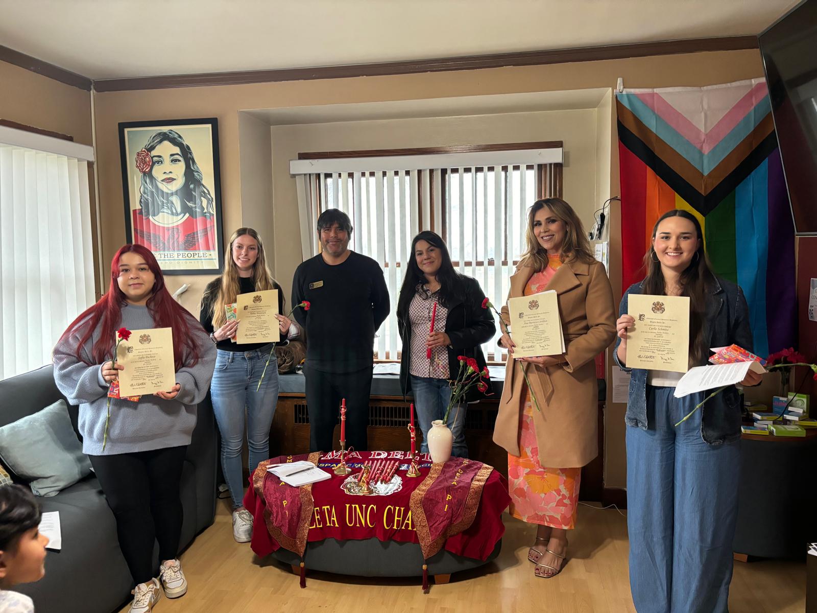 Sigma Delta Pi students holding certificates