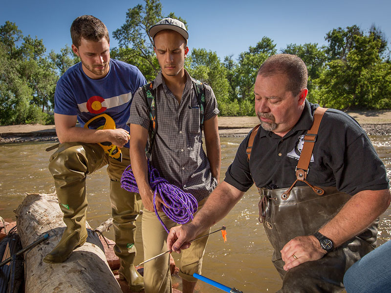 Dean James Doerner participating in a lab with students