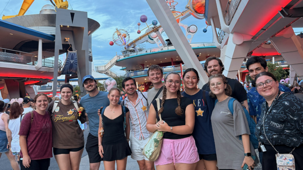 UNC alumni Brevin Bazurto posing in a sci-fi themed area of Walt Disney World with other interns.