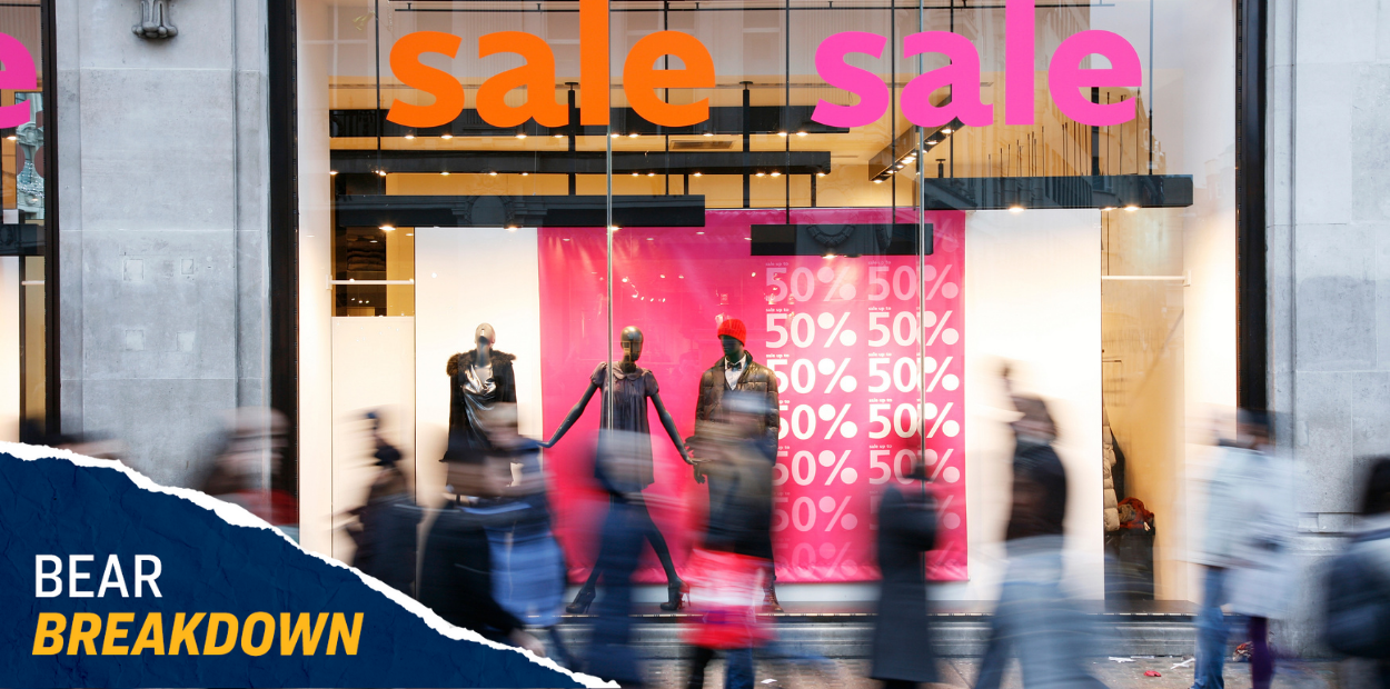 A shop that has a sign that says sale and 50% in the window frame