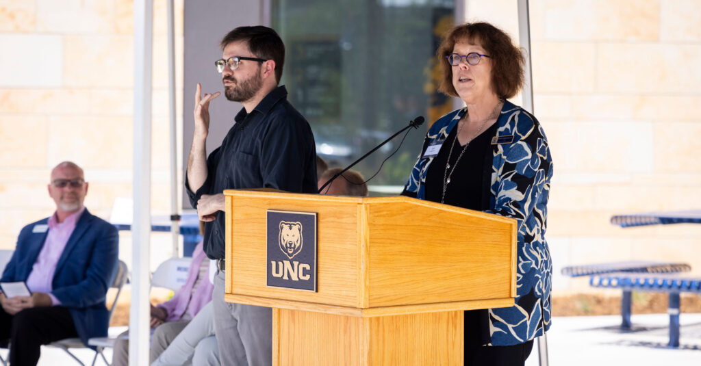 Dr. Beth Longenecker speaking at the COM ribbon cutting ceremony