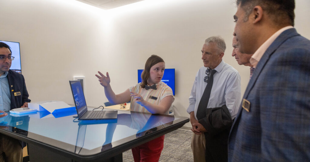 A faculty member explaining the technology inside the College of Osteopathic Medicine