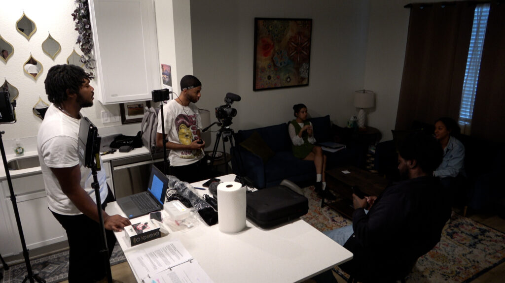 A group of UNC students working on a film in an Airbnb