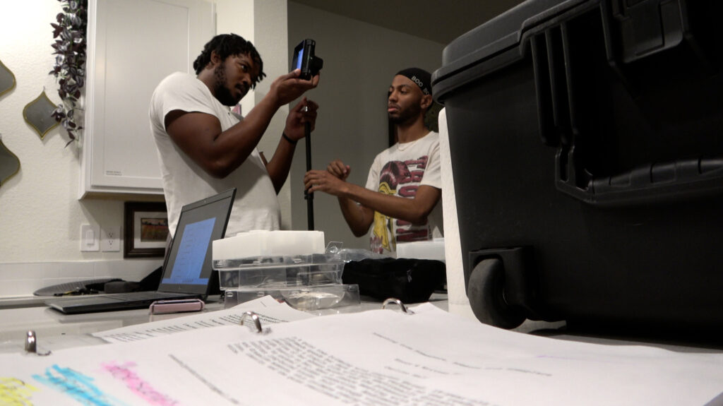 Carlito Hale putting together a camera