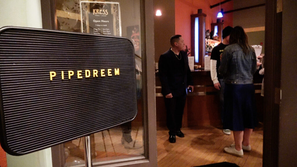 A sign that says PipeDreem inside Kress Cinema