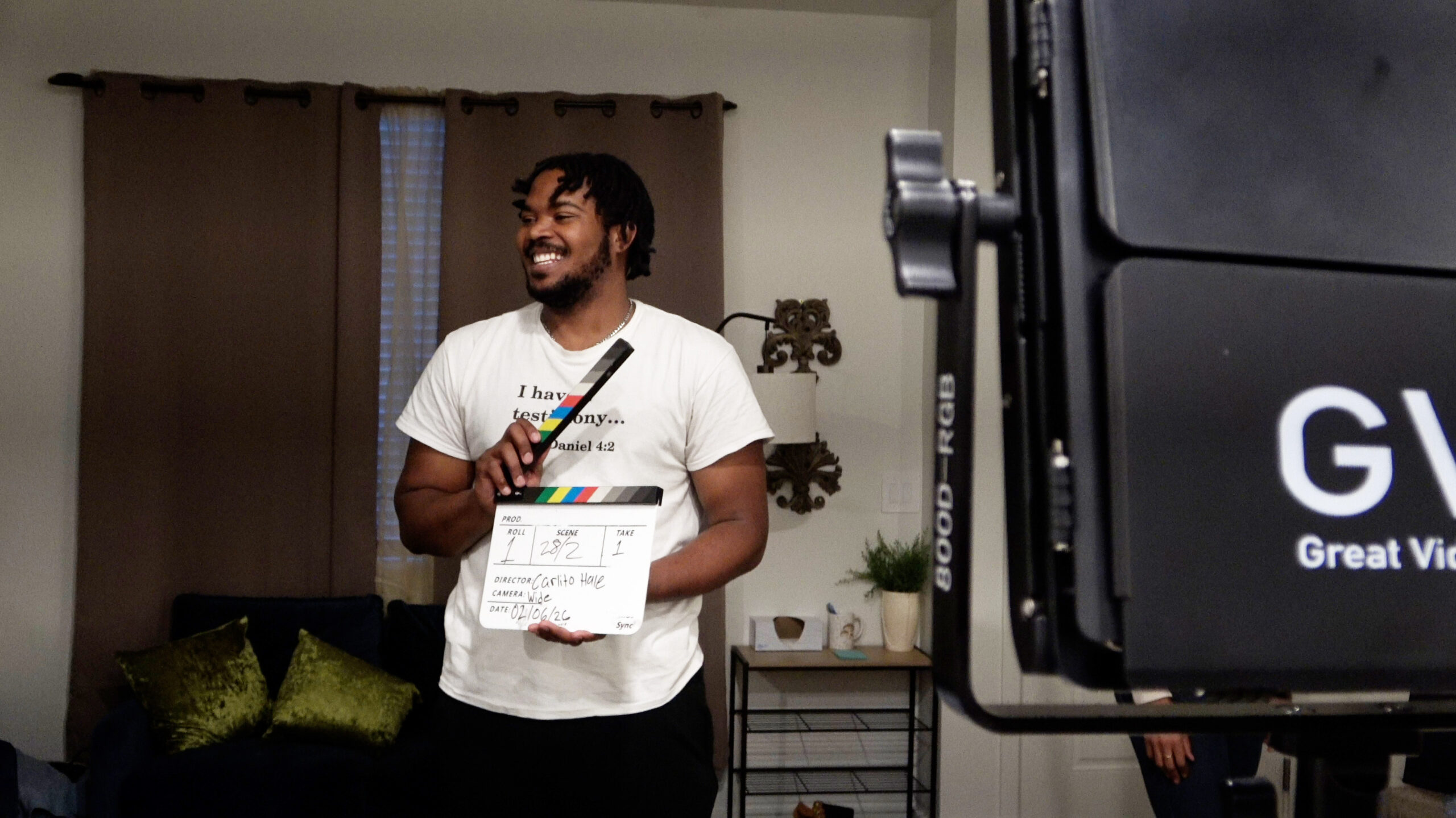 Carlito Hale holding up a clap board