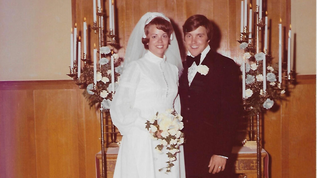 Chris and Dona White at their wedding smiling