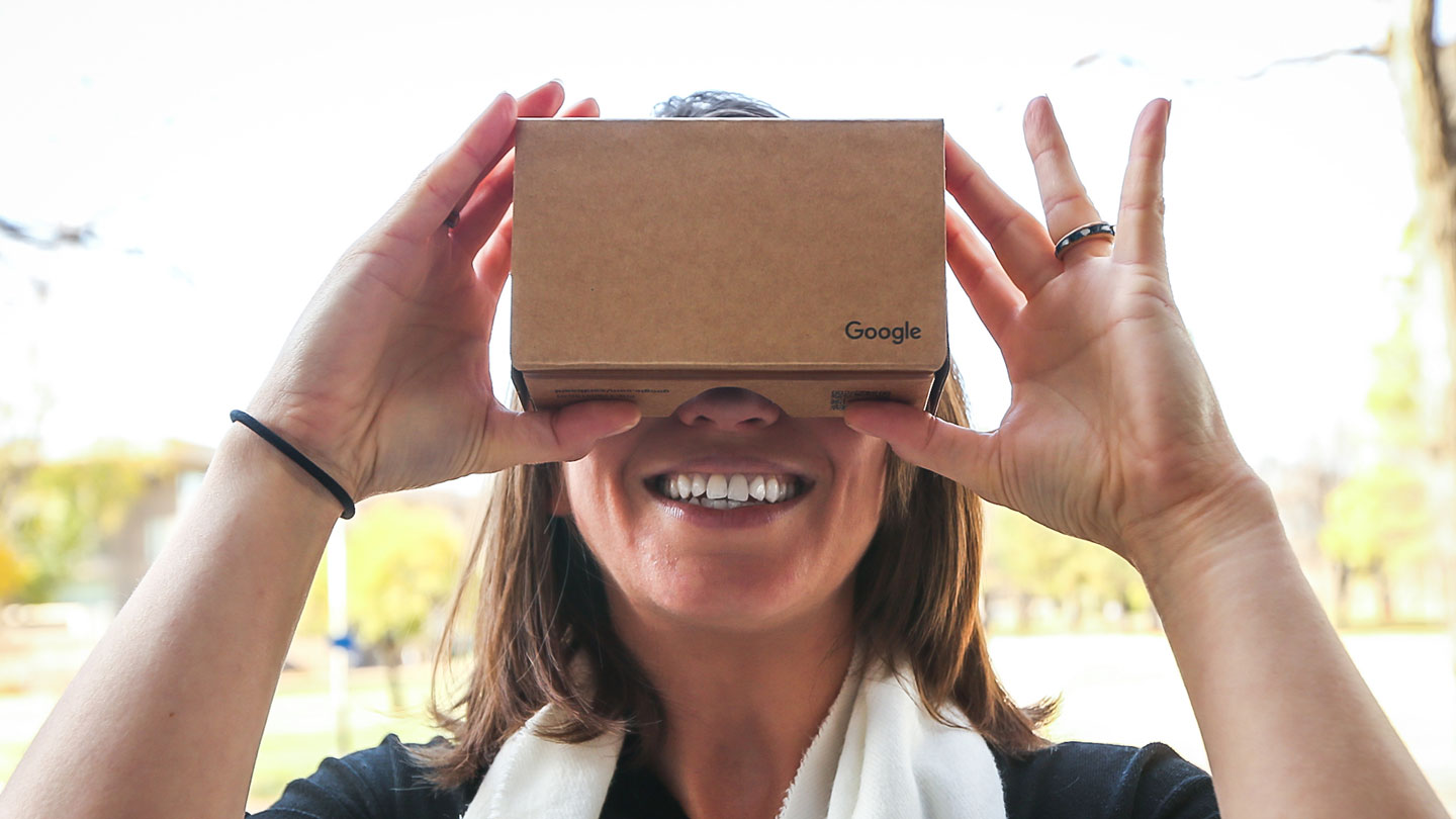 Student looking through a virtual reality device.