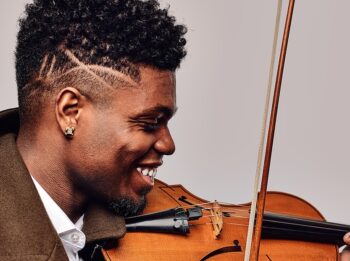PhD Music student Edward Hardy, a critically acclaimed Black and Puerto Rican composer and musician, plays the violin.