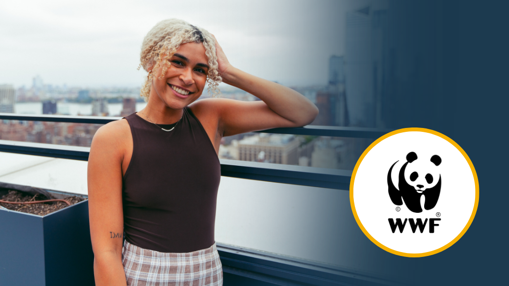 UNC alumna Emmy Scott posing on a rooftop, with the World Wildlife Fund logo added to the corner of the image.