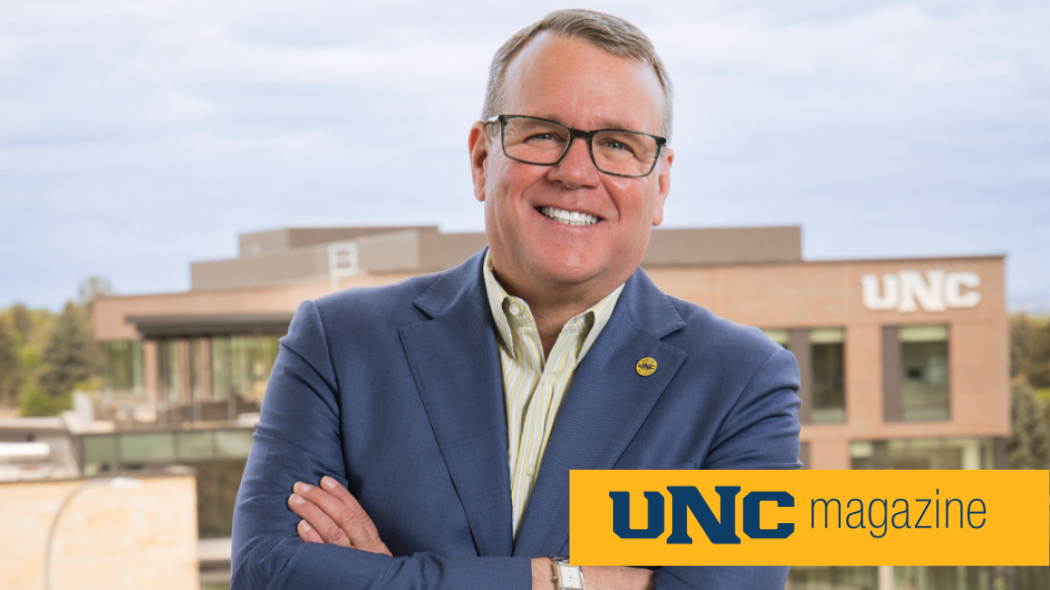 UNC President Andy Feinstein standing in front of the College of Osteopathic Medicine building.