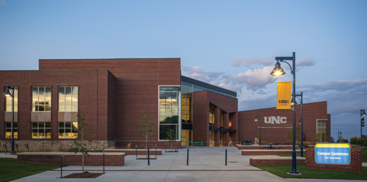 An exterior shot of UNC's Campus Commons building at dusk.