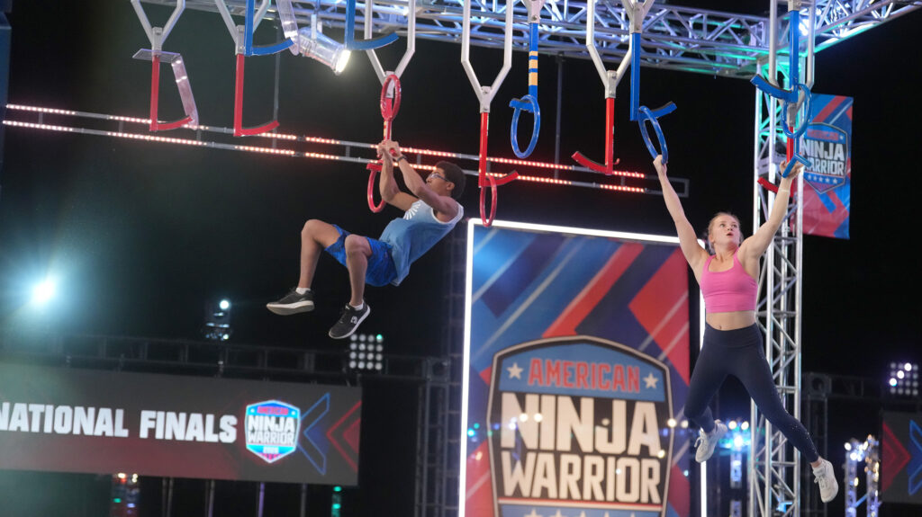 Taylor Greene competing against a male Ninja on American Ninja Warrior