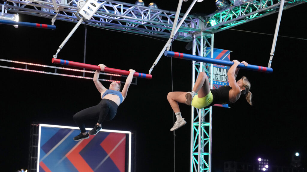 Taylor Greene competing against a female Ninja on American Ninja Warrior