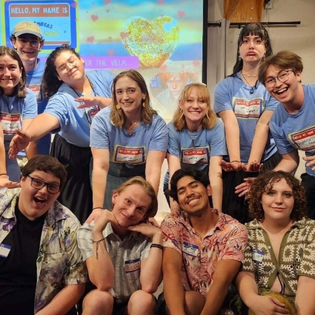 A group of students smiling and being quirky towards the camera