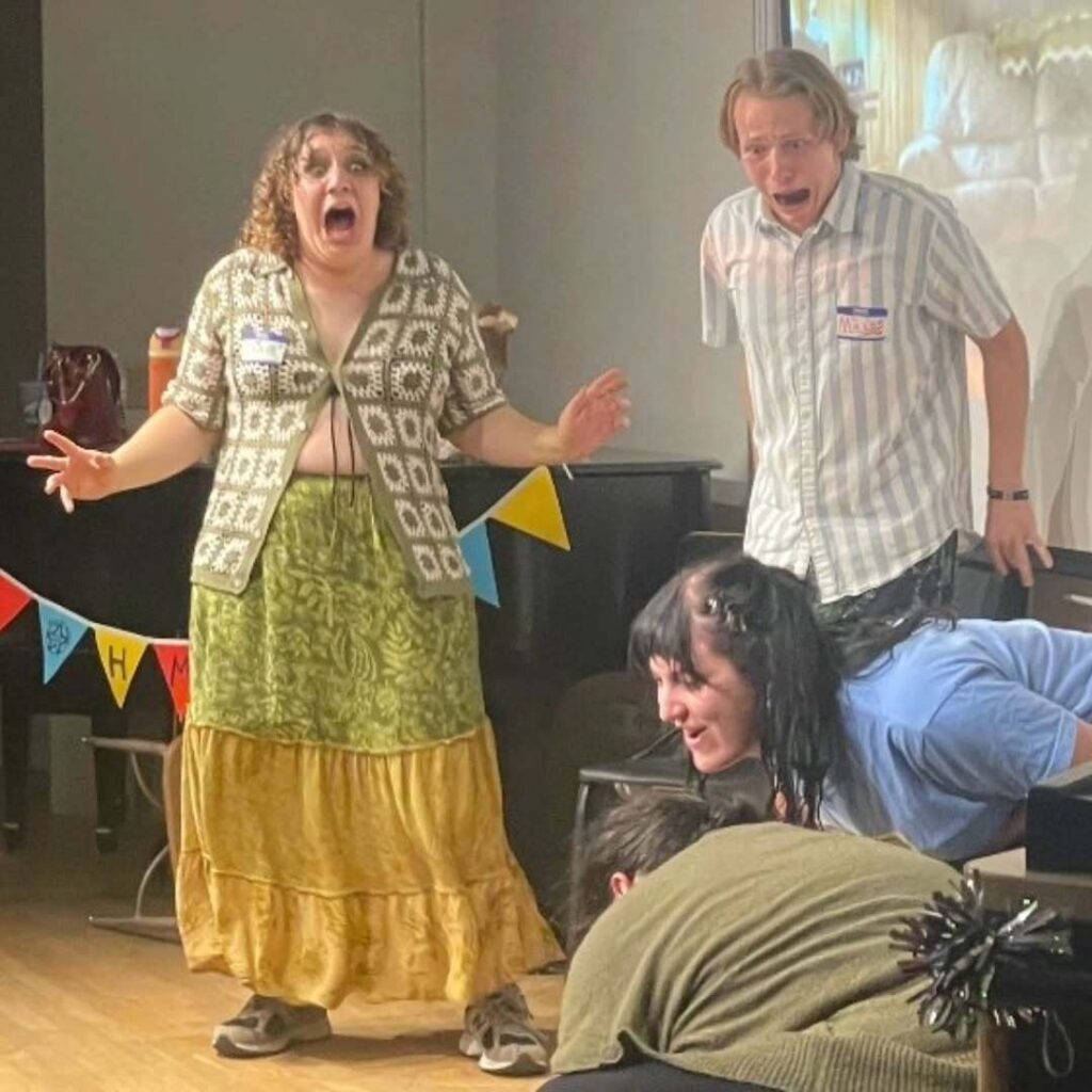 Four students on stage live acting together