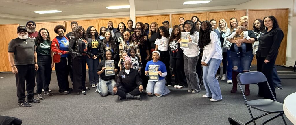 2026 graduate Janai McDonald with Denver-area students she counsels